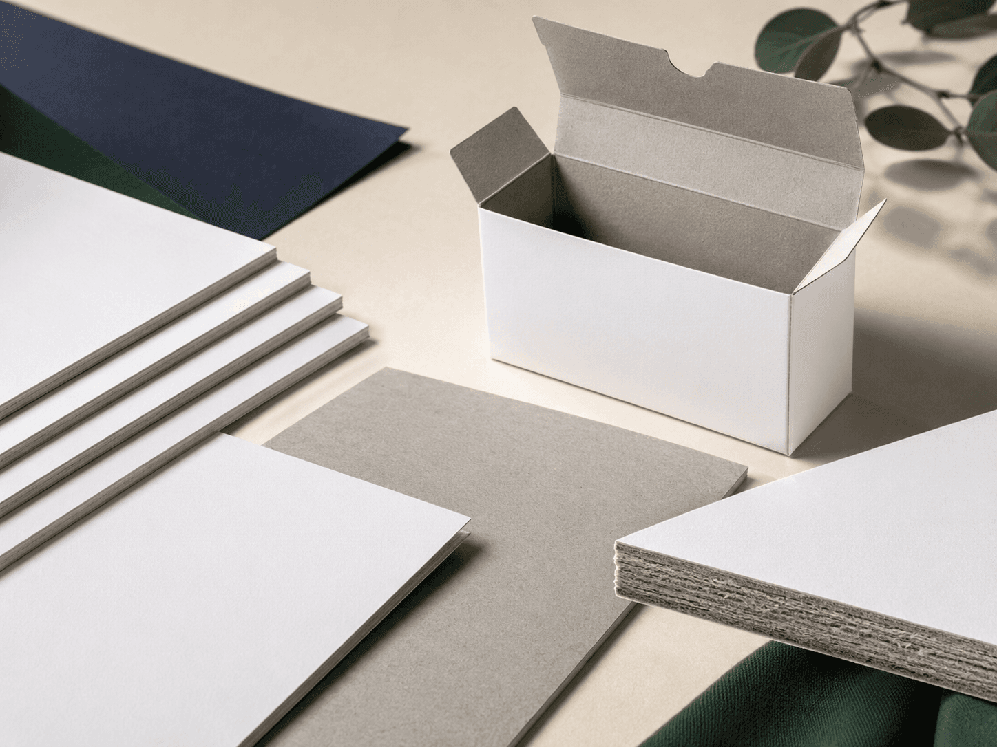 Duplex cardboard sheets showing white printable side, grey reverse side and carton sample.