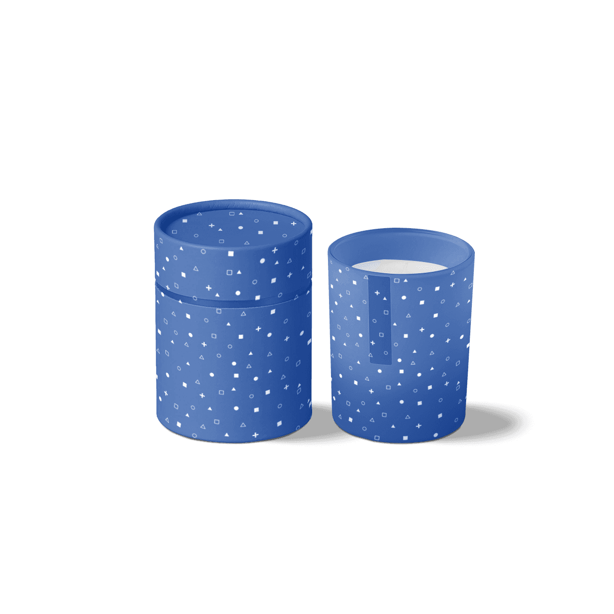Printed candle tubes in thick paperboard with fitted lids, styled for premium candle packaging and refined home fragrance presentation.